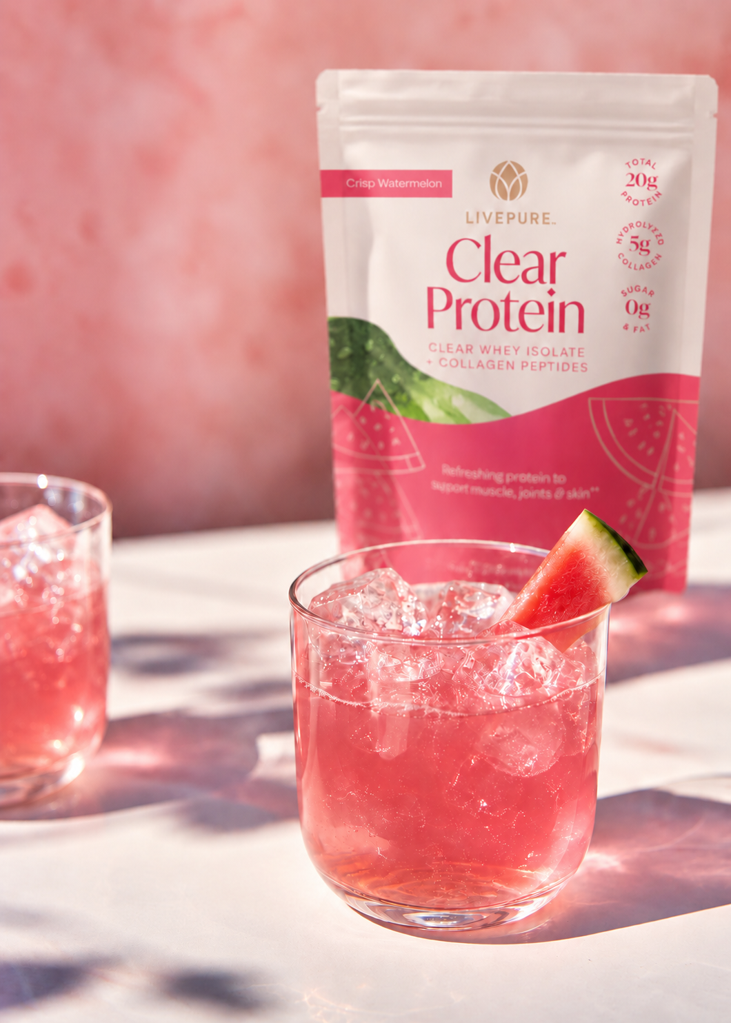LivePURE Clear Protein with watermelon and glasses of the refreshing pink drink